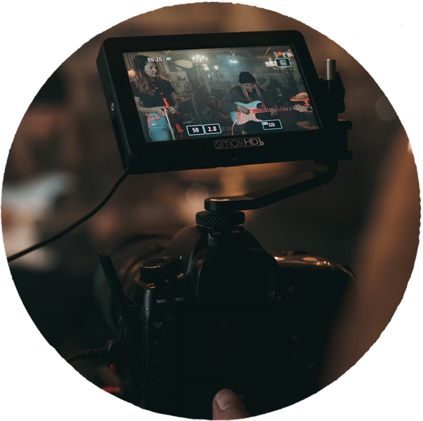 close- up view of a camera screen recordinhg a band at a restaurant